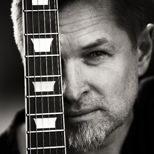 Award-winning photograph Portrait with guitar by Dawid Grzeganek, 2026 MUSE Photography Awards Silver Winner