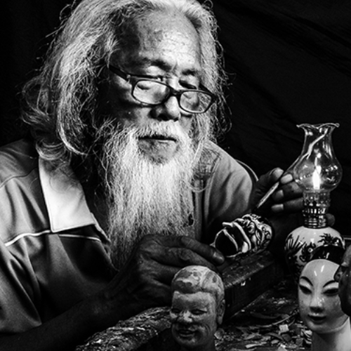 Award-winning photograph Carving Puppet Master 02 by HO, WEI-CHIN, 2026 MUSE Photography Awards Gold Winner