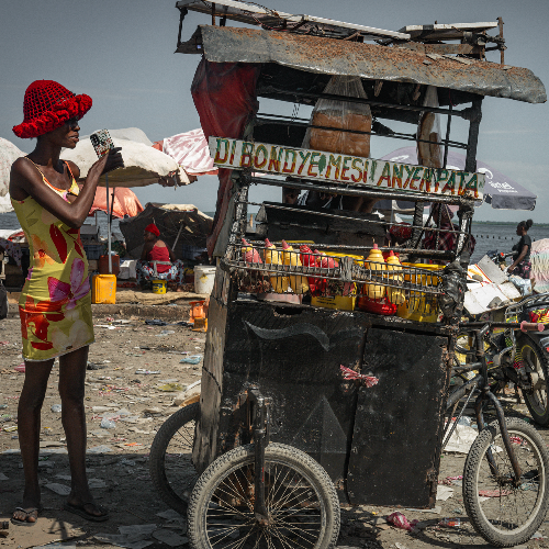Award-winning photograph The homeless street vendor by Philipp Schmieja, 2026 MUSE Photography Awards Platinum Winner